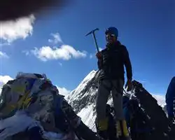 Kang Yatse 2 Expedition – ashwin standing on top of kang yatse 2 summit | Himalayan High