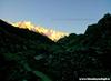 kanchenjunga turns golden with dawn as the team walks through the night